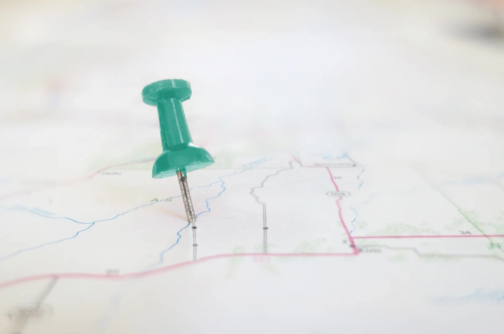map-pin-teal-100x663 Green pin on a map